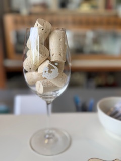 Wine glass filled with corks