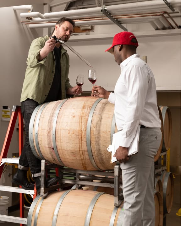 Winemaker and student test a vintage