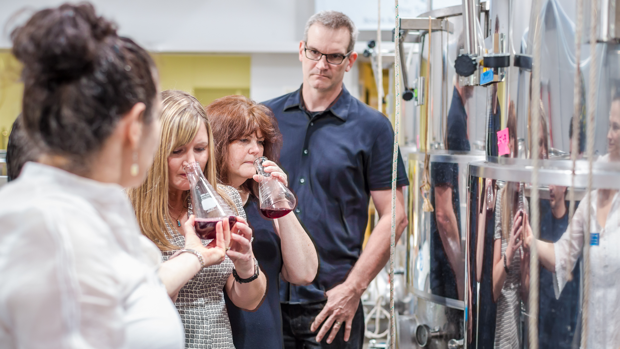 Students learning to make wine