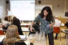 Instructor pouring wine